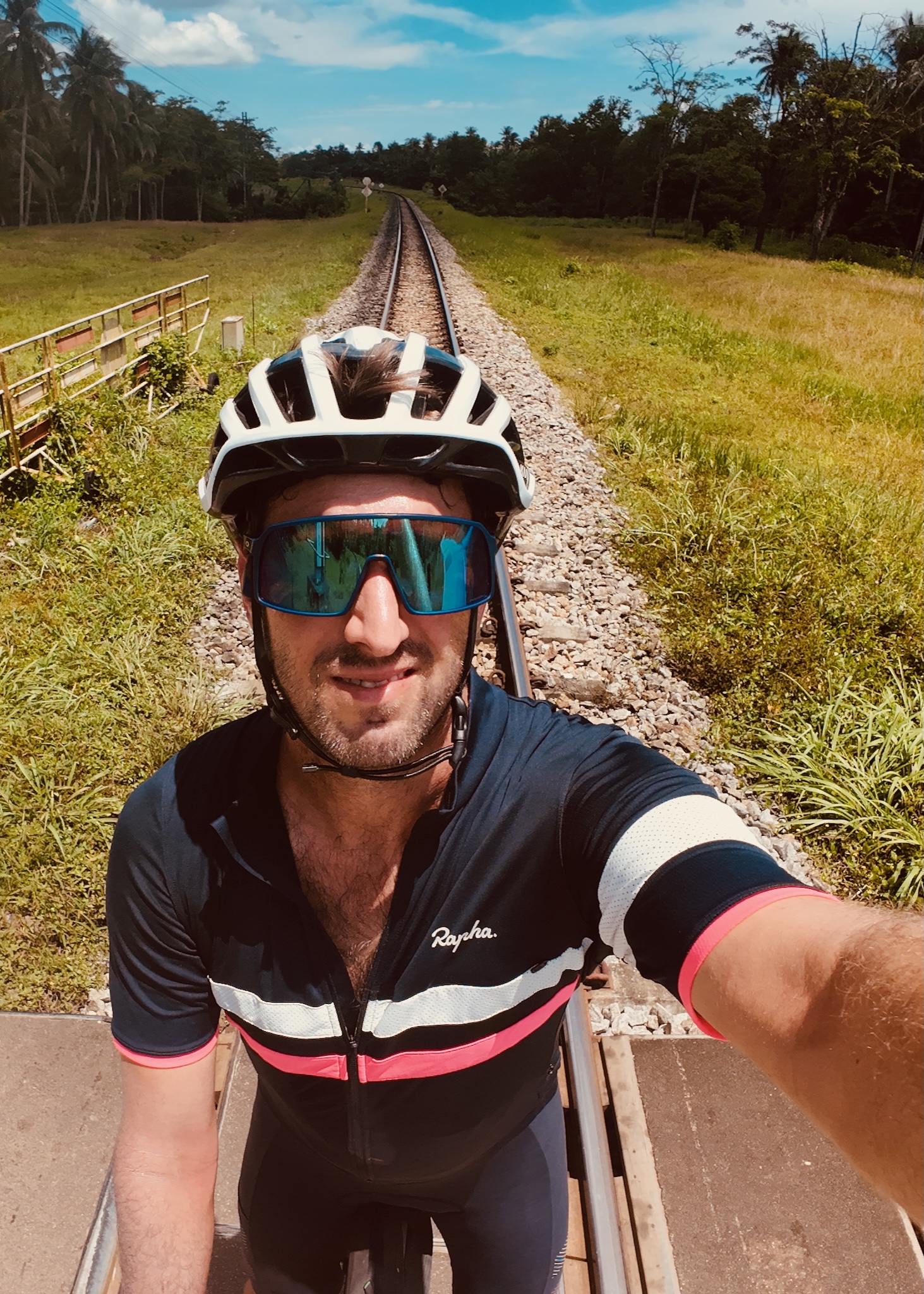 The bike on a railway crossing running dead straight to the horizon