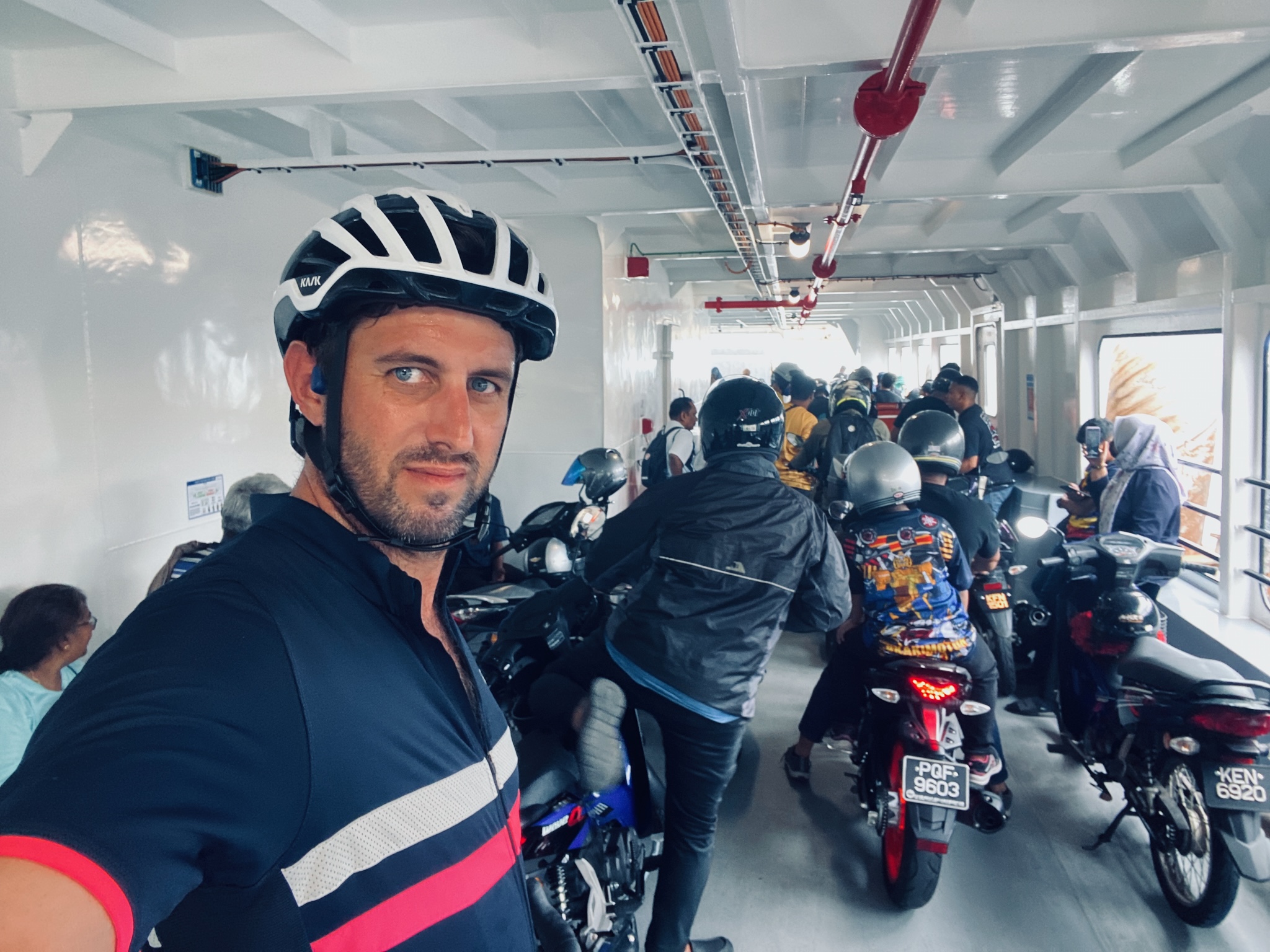 On the Penang ferry, packed in among the motorbikes