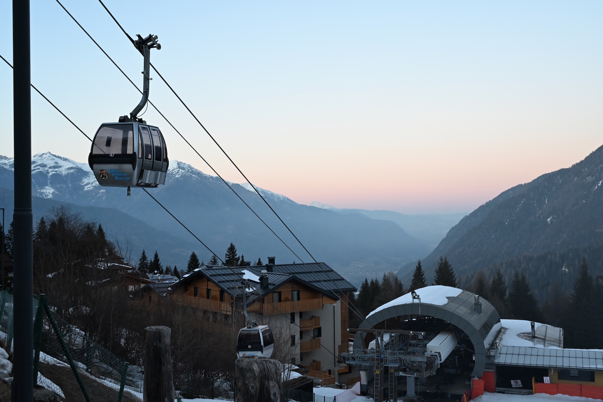 A gondola above the village at dusk