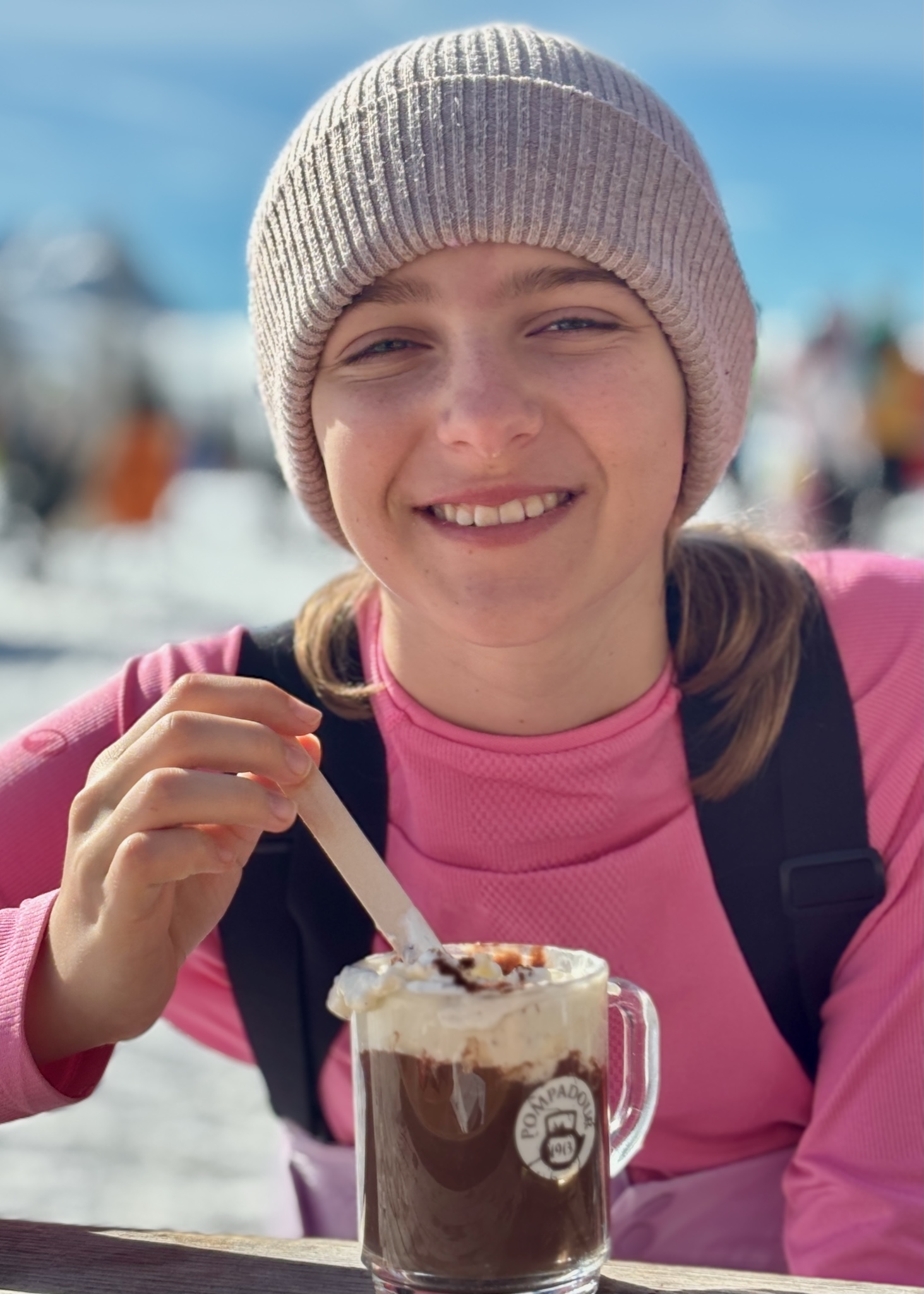 A girl with a tall hot chocolate