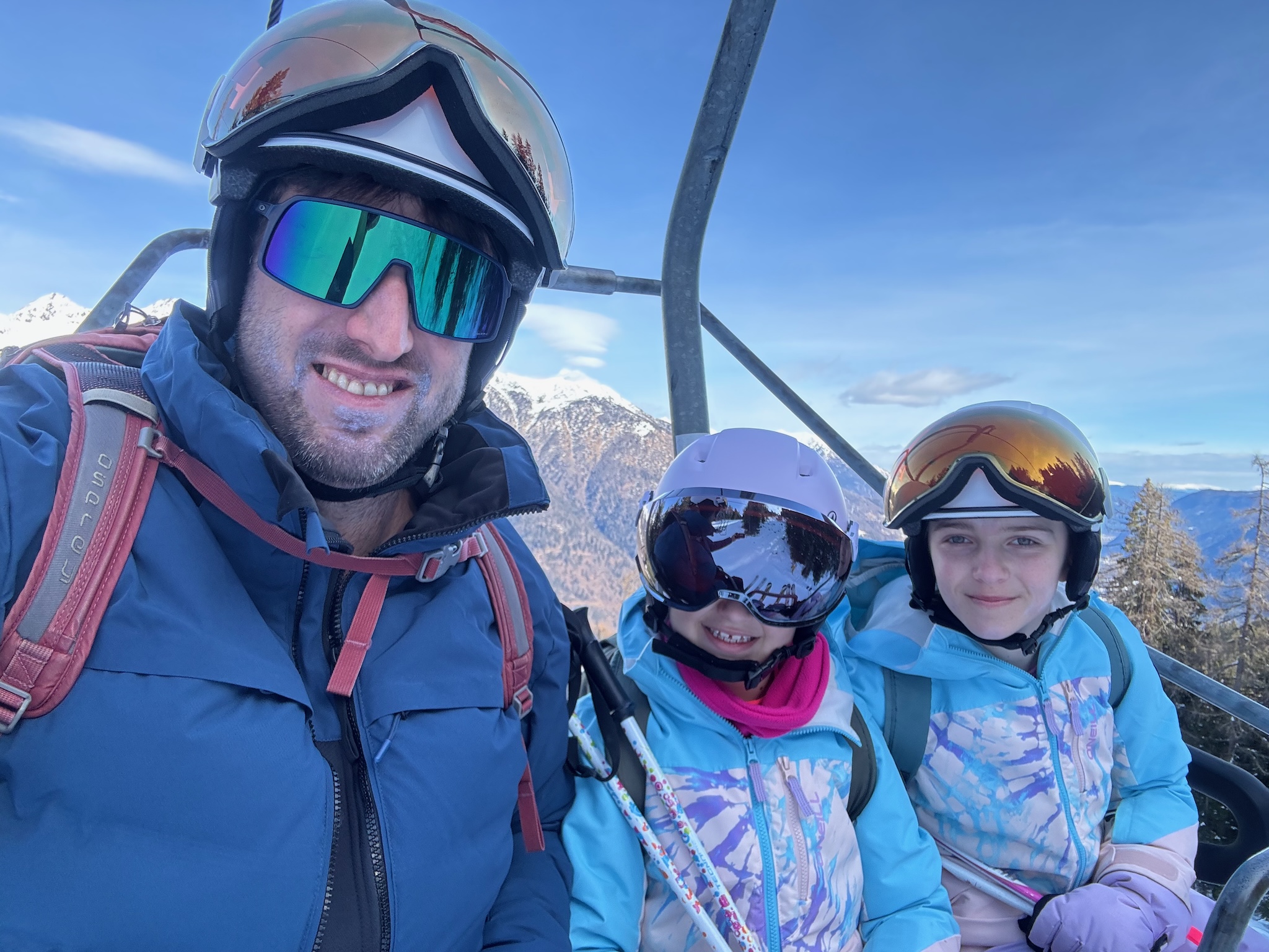 A chairlift selfie with both daughters