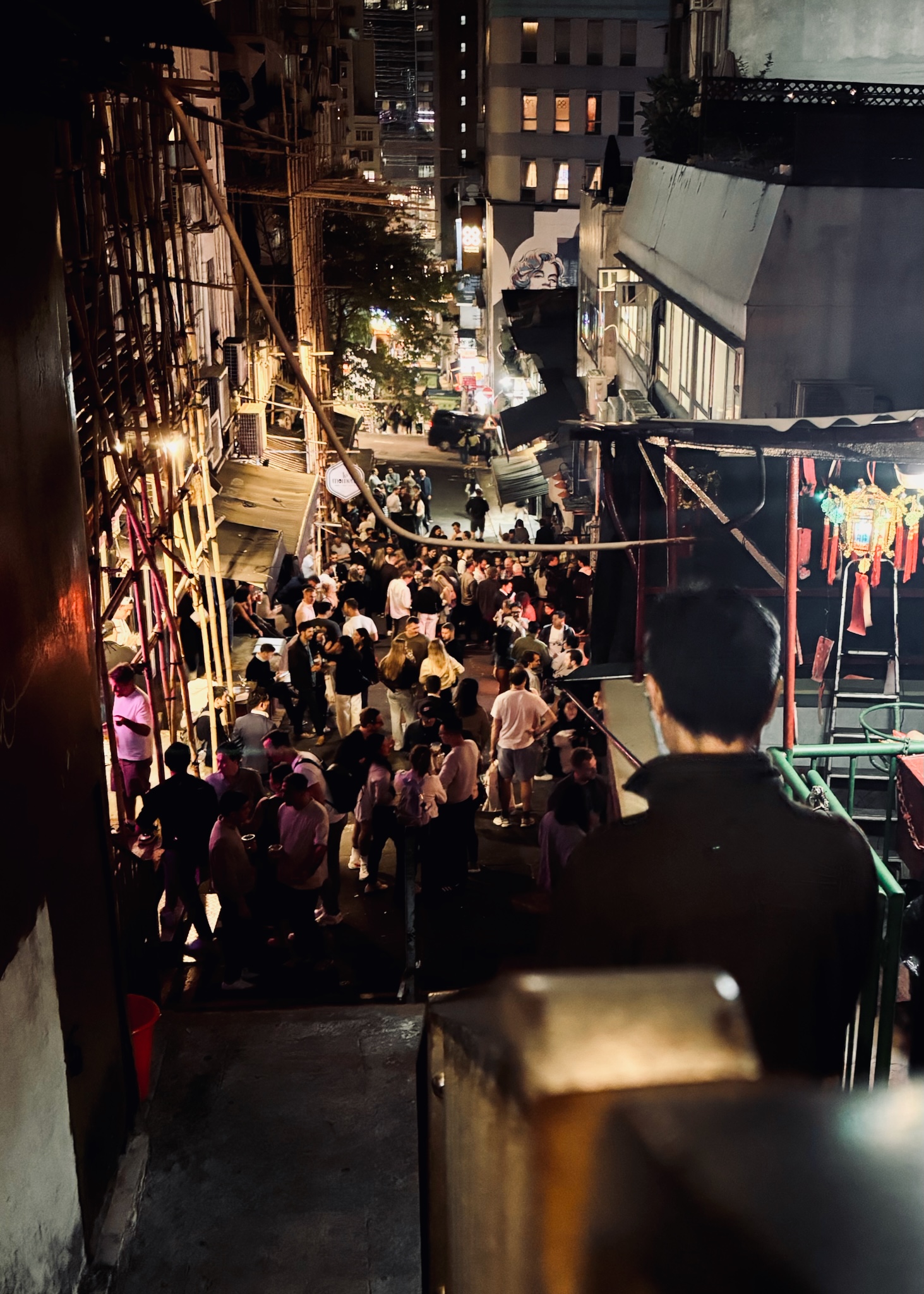 A crowd filling Lan Kwai Fong at night