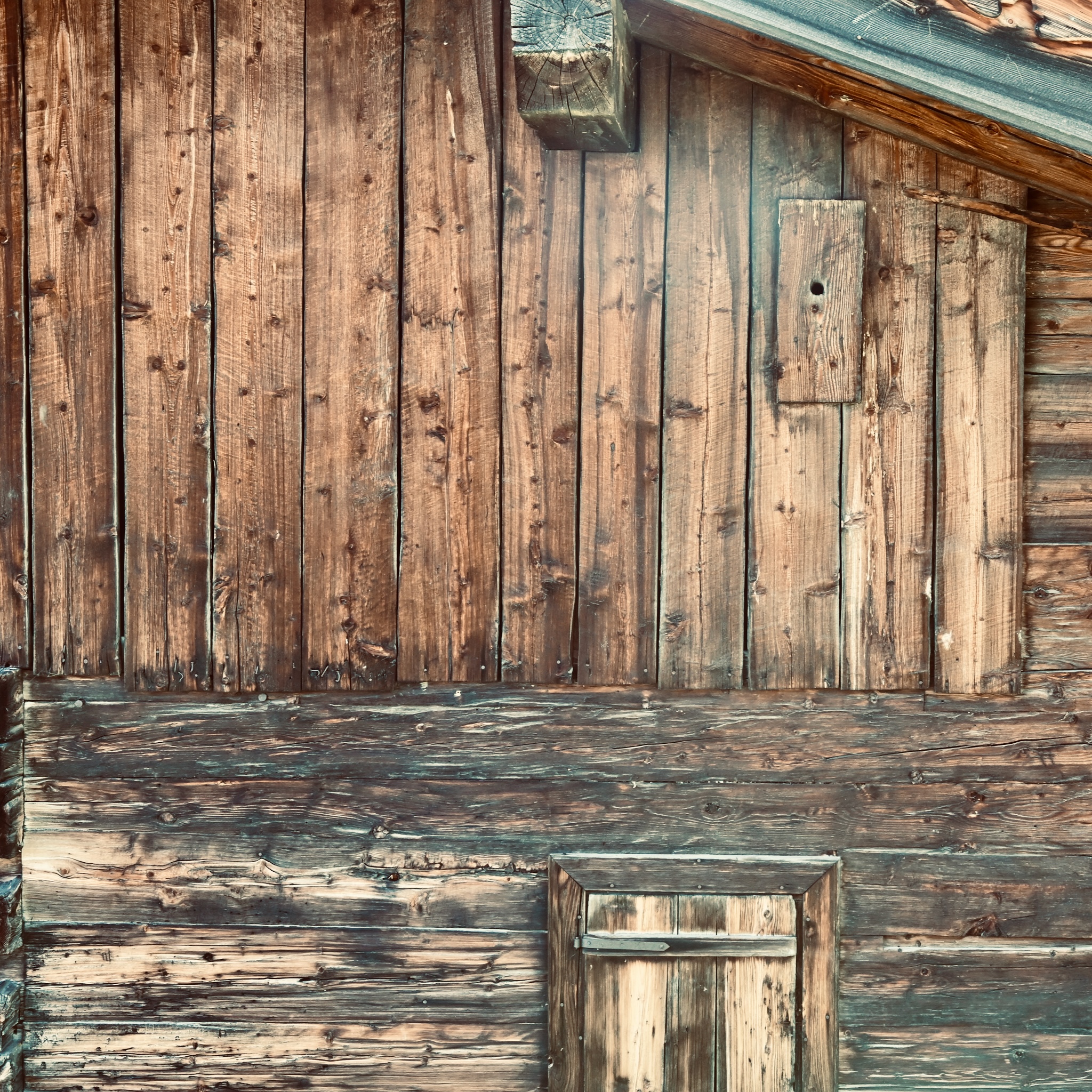 Weathered timber of an old alpine barn
