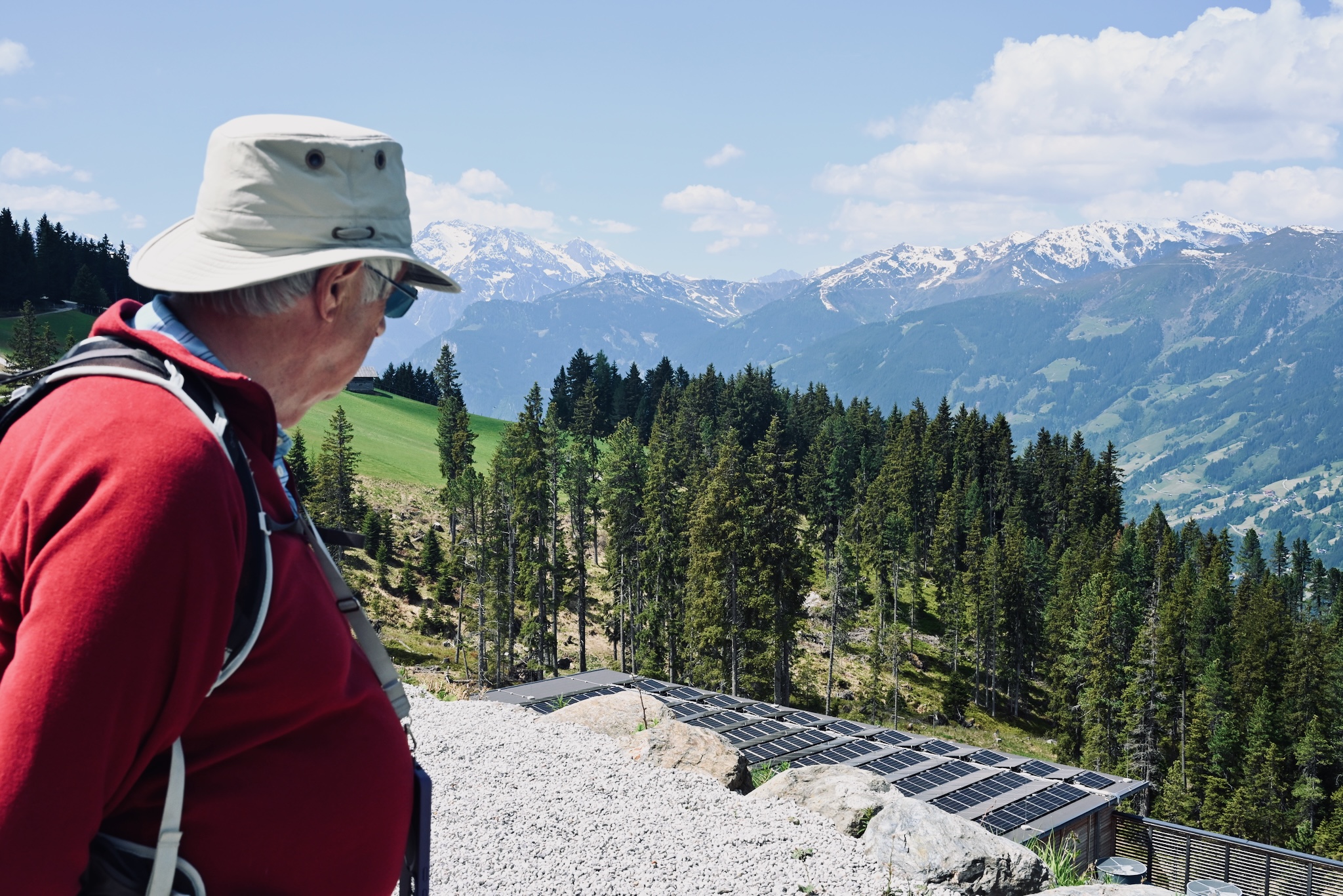My father looking out over the valley and solar panels