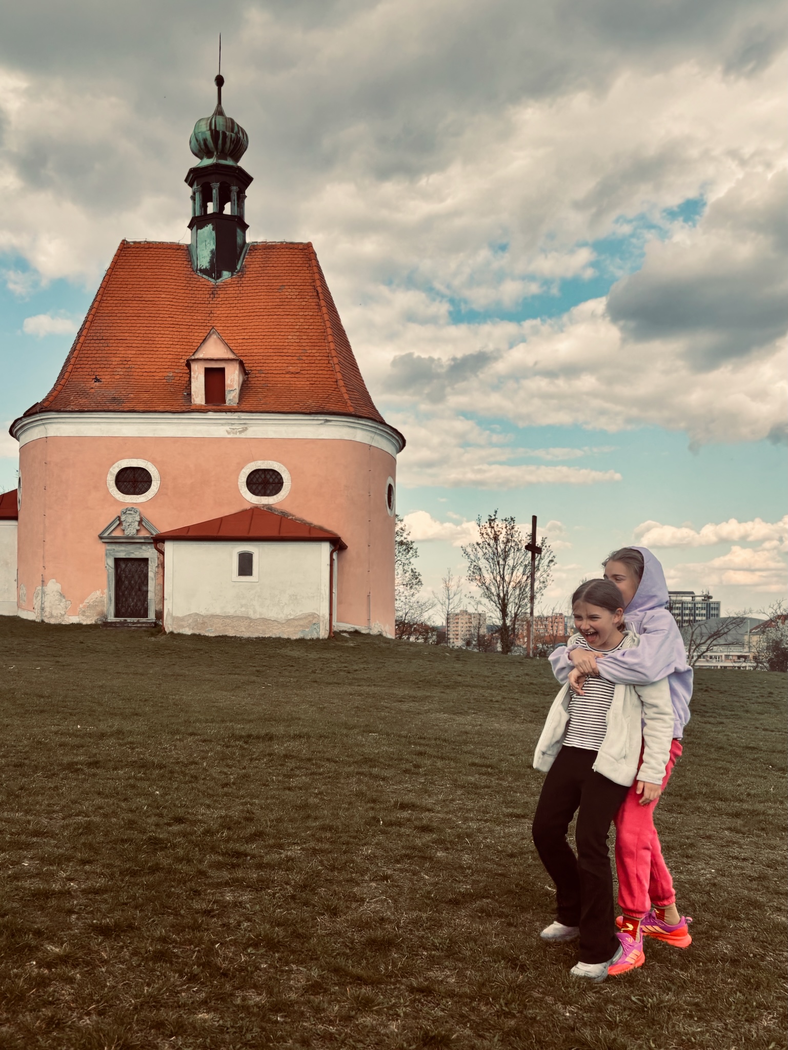 The two girls below the round chapel