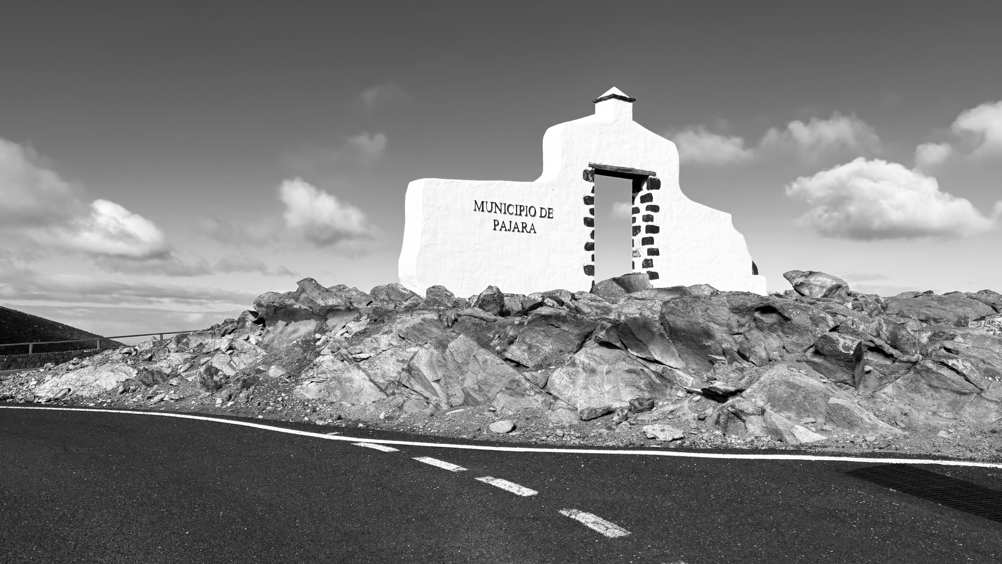 A whitewashed municipal monument reading Municipio de Pajara, in black and white