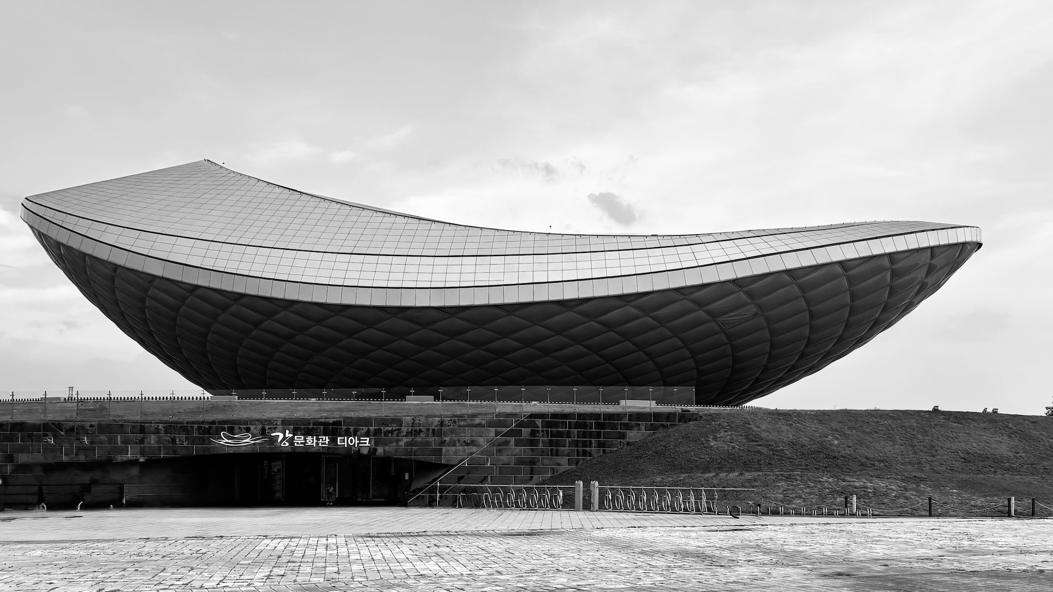 The ARC, a sculptural river-culture building, in black and white